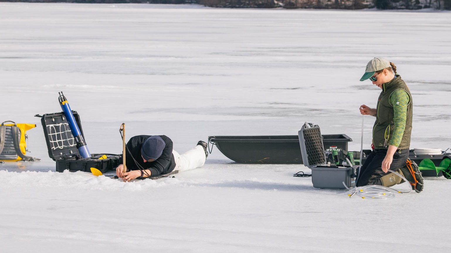 LEA staff taking measurements on the ice of Sand Pond