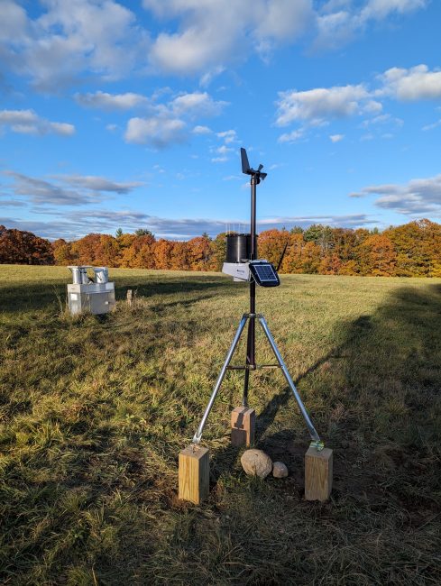 Picture of small weather station in open field